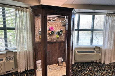 Display case with flowers in an indoor area