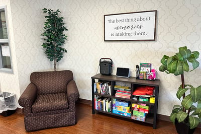 Cozy lounge area with books and a chair