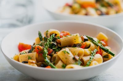 A plate of pasta with vegetables