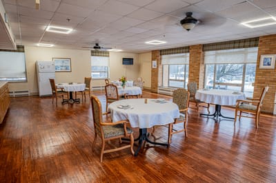 Bright dining area with tables set for meals