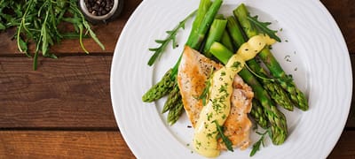 Plated meal featuring fish and asparagus