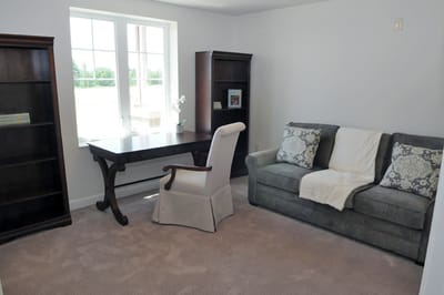 Cozy resident room with sofa and desk