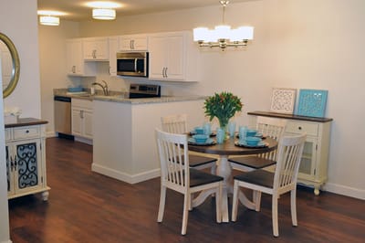 Bright interior dining area with a table set for a meal