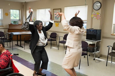 Residents enjoying a lively activity in a common area