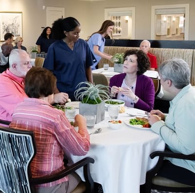Residents enjoying lunch together in the dining area