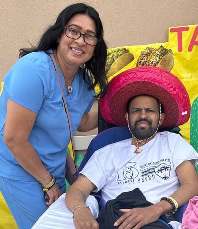 Staff member and resident celebrating outdoor activity