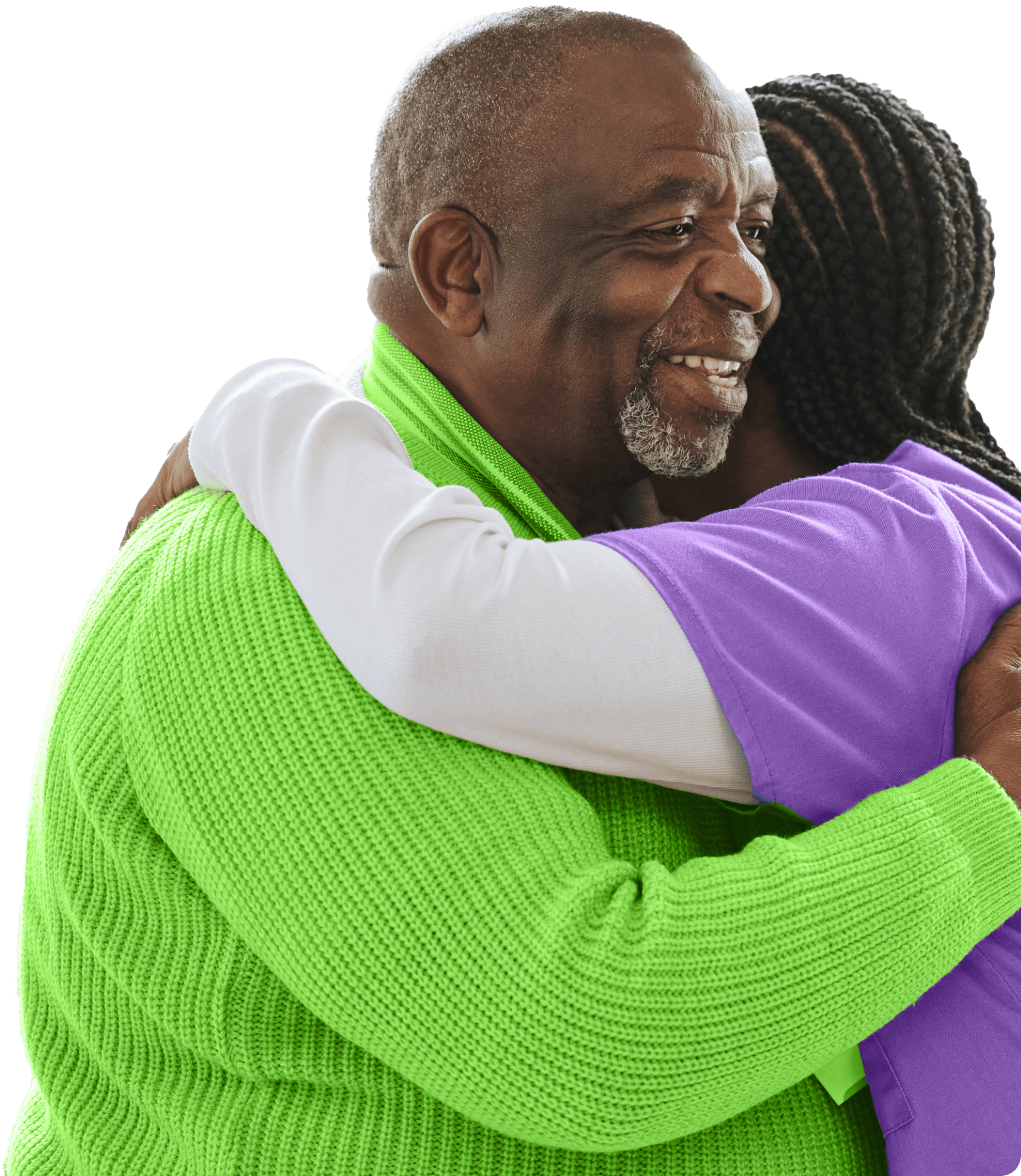 A resident and staff member sharing a warm hug