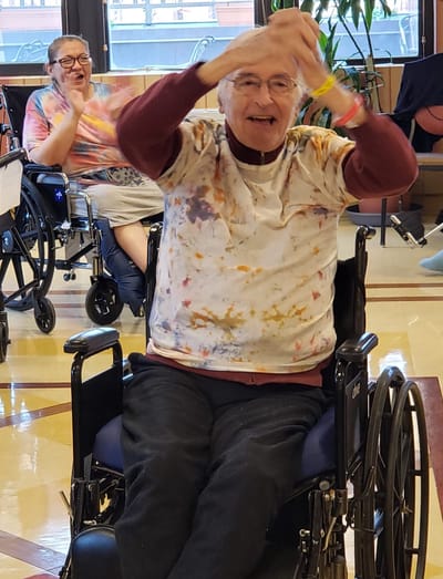 Residents engaging in a creative activity in the facility's common area
