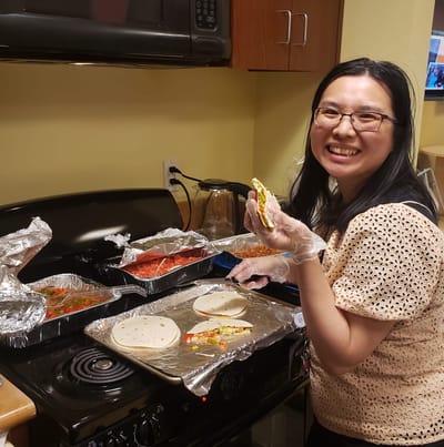 Staff member preparing food in a kitchen