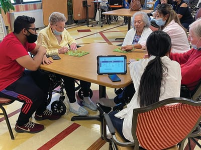 Residents playing bingo in a common area