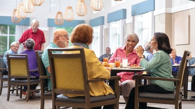 Residents enjoying a meal in the dining room