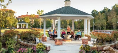 Residents enjoying time in a garden gazebo