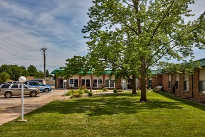 Exterior view of Cameron Nursing Center's entrance and landscape