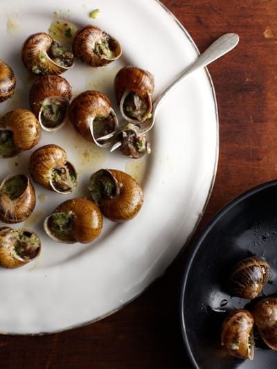 Plate of escargot prepared with garlic and herbs