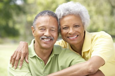 Two residents smiling together outdoors