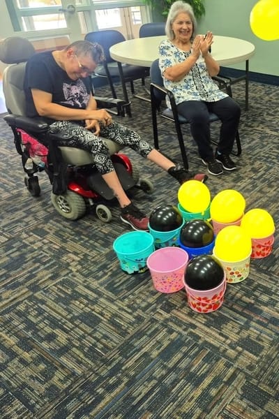 Residents participating in a fun balloon activity