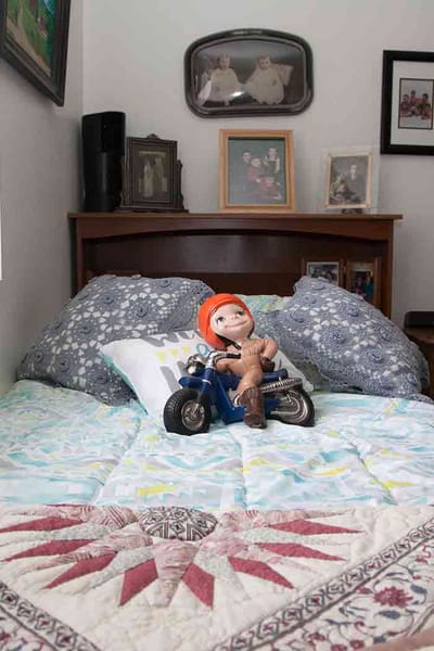 Decorative bedroom with doll on a bed