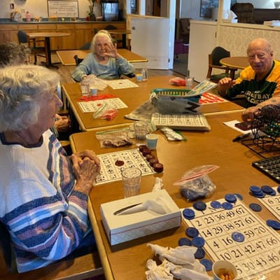 Residents enjoying a bingo game in a common area