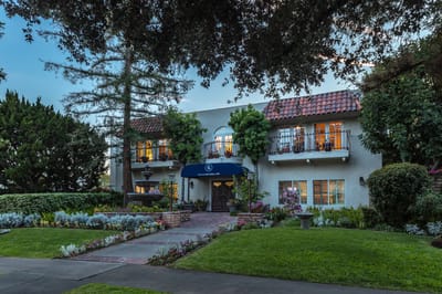 Exterior view of Regency Park Oak Knoll with a garden
