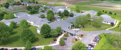 Aerial view of Valley View Retirement Center with gardens and parking