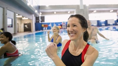 Residents participating in an aquatic exercise class