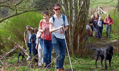 Residents and staff enjoying a guided outdoor hike
