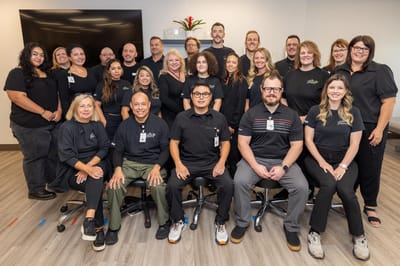 Staff members posing together in a communal area