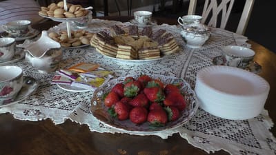 A table set with pastries and strawberries for a gathering