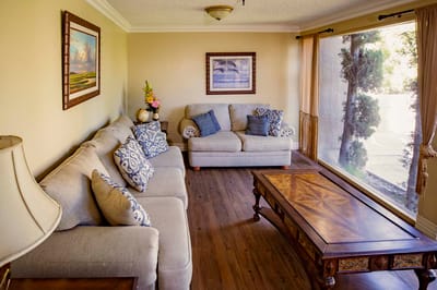 Bright common area with comfortable seating and windows