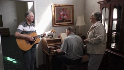 Residents enjoying music activity in a common area