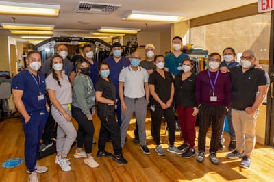 Group of staff members in a facility activity room