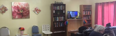 Common area with seating and bookshelves