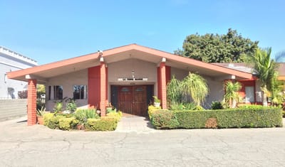 Exterior view of La Verne Manor with greenery