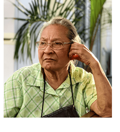 Senior woman with thoughtful expression indoors
