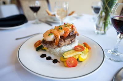 A beautifully plated seafood dish on a dining table