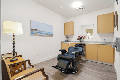 Interior of a salon space with a chair and decor