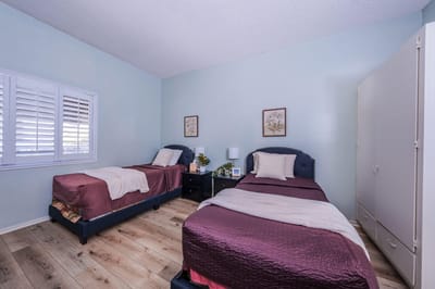 Shared resident room with twin beds and decor