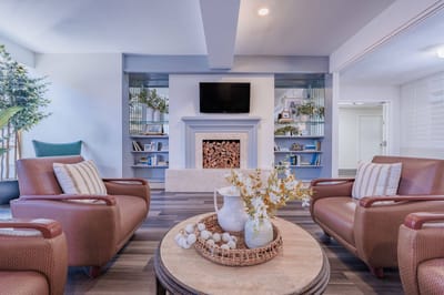 Cozy common area with a fireplace and seating