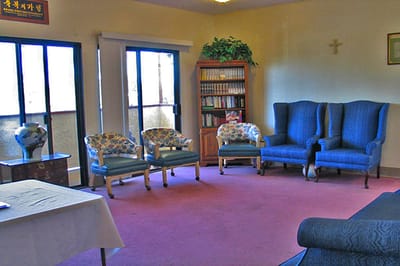 Common area with seating and bookshelves