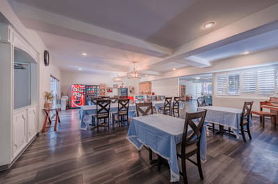 Bright dining area with tables in an interior setting