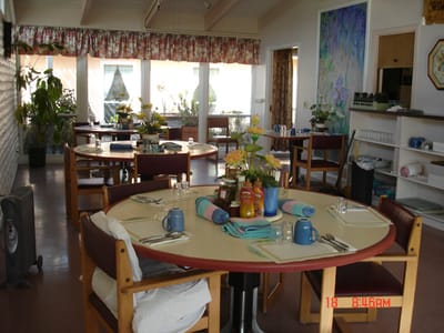 Dining room set up with tables and decorations