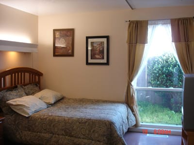 Cozy resident room with a bed and window view