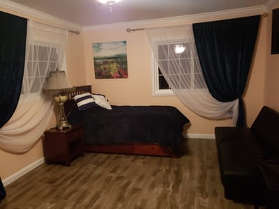 Cozy private room with bed and seating area
