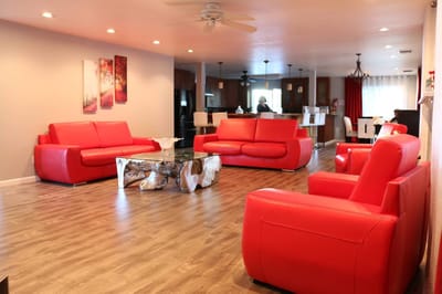 Interior of a common area with red sofas and decor