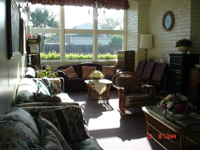 A cozy common area with comfortable seating and natural light