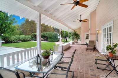 An outdoor space with seating and greenery