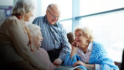 Residents and staff interacting in a common area