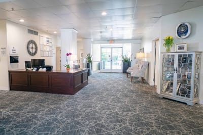 Bright interior lobby with seating and front desk