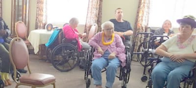 Residents in wheelchairs in a common area