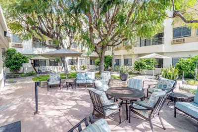 Outdoor courtyard with seating and trees